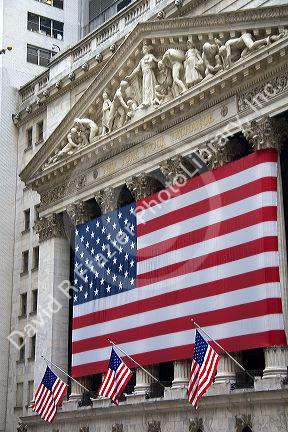 American flags in front of the New York Stock Exchange in New York City, New York, USA.