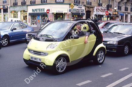 Mercedes Smart Car in traffic.