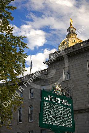 Presidential primary sign and gold dome of the capitol building in the city of Concord, New Hampshire, USA.
