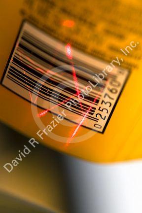 Laser scanning a UPC barcode.