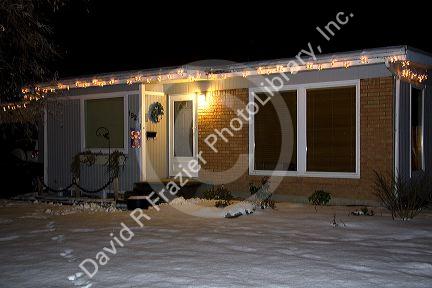 Ranch style residential home decorated with christmas lights in Boise, Idaho, USA.