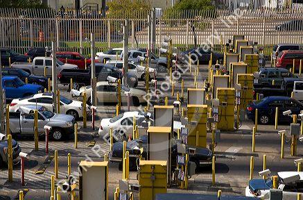 Automobiles being monitored by video cameras wait to enter the United States port of entry at the Tijuana, Baja California, Mexico/San Diego, California border crossing.