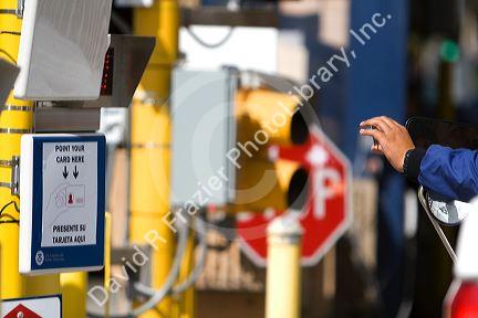 Automated scanner reading a biometric Border Crossing Card at the United States port of entry at the Tijuana, Baja California, Mexico/San Diego, California border crossing.