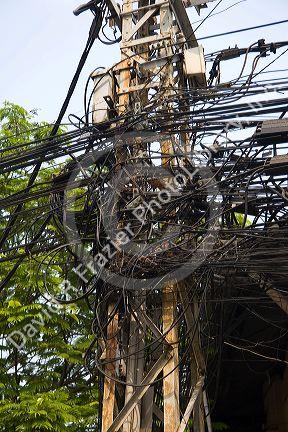 A tangle of telephone wires on a utility pole in Ho Chi Minh City, Vietnam.