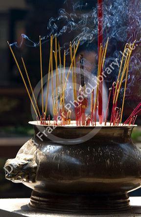 Incense burning at the Quan Am Pagoda, a famous Chinese temple in the Cholon district of Ho Chi Minh City, Vietnam.