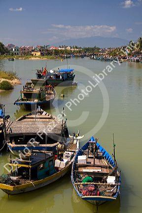 Boats on the Thu Bon River at Hoi An, Vietnam.