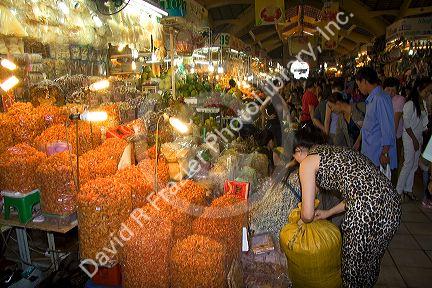 Vendors selling dried shrimp in the Ben Thanh Market located in Ho Chi Minh City, Vietnam.