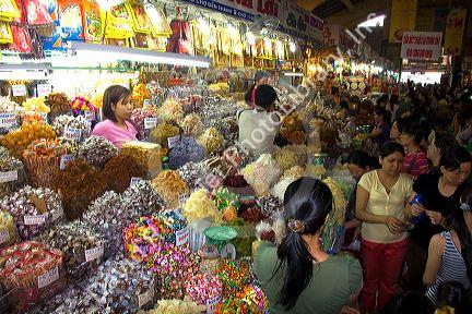 Vendors selling treats in the Ben Thanh Market located in Ho Chi Minh City, Vietnam.