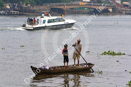 Sampan flat bottom wooden boat on the Saigon River in Ho Chi Minh City, Vietnam.