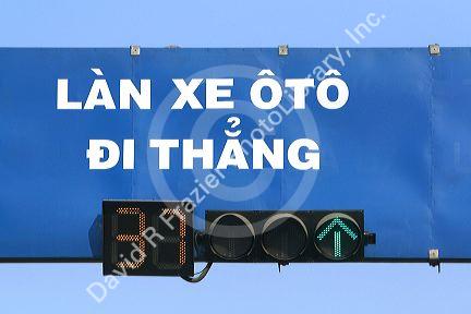 Traffic signal in Ho Chi Minh City, Vietnam counts down remaining seconds to color change.