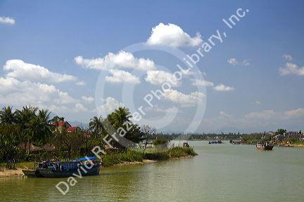 Boats on the Thu Bon River at Hoi An, Vietnam.