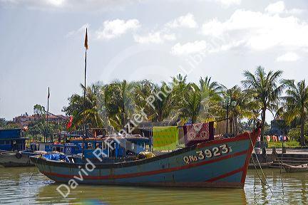 Boats on the Thu Bon River at Hoi An, Vietnam.