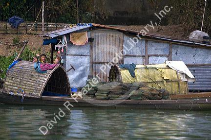 Vietnamese children living along the Perfume River at Hue, Vietnam.