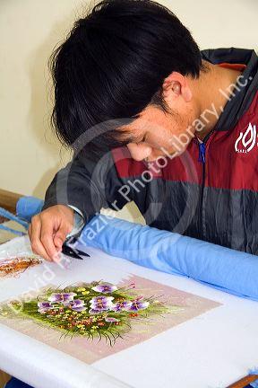 Disadvantaged Vietnamese youth learn embroidery at a vocational school named Kids First Vietnam in Dong Ha, Vietman.