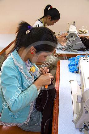 Disadvantaged Vietnamese youth learn to use a sewing machine at a vocational school named Kids First Vietnam in Dong Ha, Vietnam.