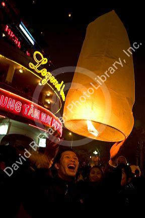 Vietnamese people celebrate Tet by releasing Sky Lanterns in Hanoi, Vietnam.