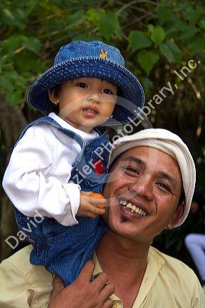 Vietnamese father and daughter at the Saigon Zoo and Botanical Gardens in Ho Chi Minh City, Vietnam.