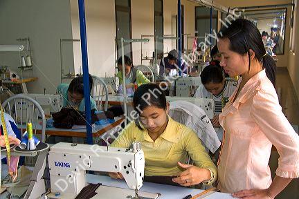 Disadvantaged Vietnamese youth learn to use a sewing machine at a vocational school named Kids First Vietnam in Dong Ha, Vietnam.