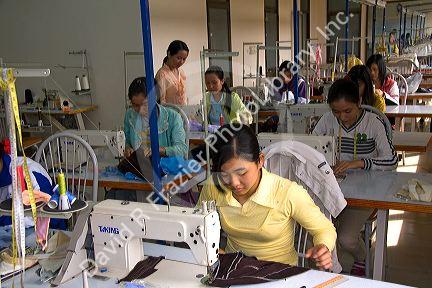 Disadvantaged Vietnamese youth learn to use a sewing machine at a vocational school named Kids First Vietnam in Dong Ha, Vietnam.
