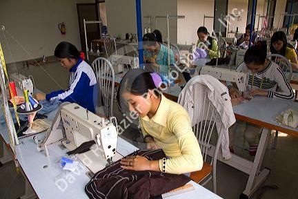 Disadvantaged Vietnamese youth learn to use a sewing machine at a vocational school named Kids First Vietnam in Dong Ha, Vietnam.
