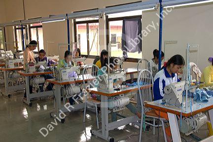 Disadvantaged Vietnamese youth learn to use a sewing machine at a vocational school named Kids First Vietnam in Dong Ha, Vietnam.