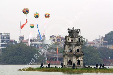 Thap Rua or the Tortoise Tower in the center of Hoan Kiem Lake in Hanoi, Vietnam.