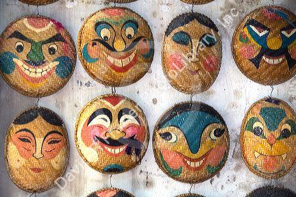 Painted ceremonial masks being sold for Tet in Hanoi, Vietnam.