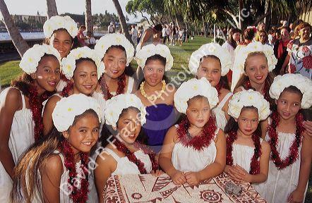 Native hawaiin girl singers and preformers dressed in traditional clothes.