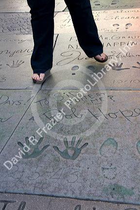 Celebrity handprints, footprints, and autograph in the concrete of the Grauman's Chinese Theatre located in Hollywood, Los Angeles, California, USA.