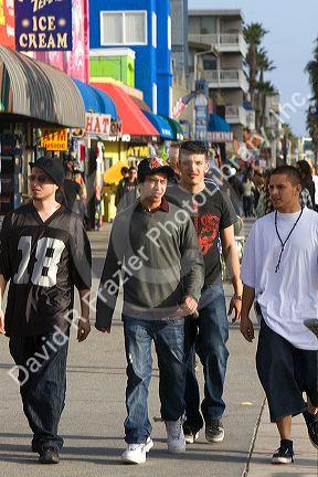 People and boardwalk retail space at Venice Beach, Los Angeles, California.