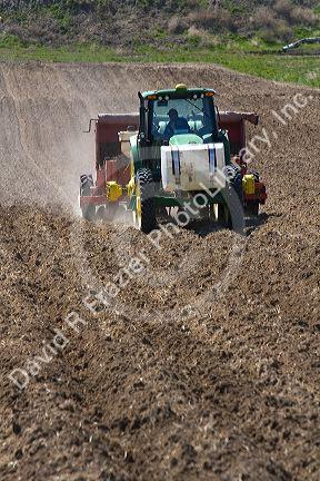 Farmer planting potato crop in Canyon County, Idaho, USA.