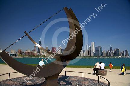 Cast bronze sundial sculpture named Man Enters the Cosmos by artist Henry Moore located on Lake Michigan outside the Adler Planetarium in Chicago, Illinois, USA.
