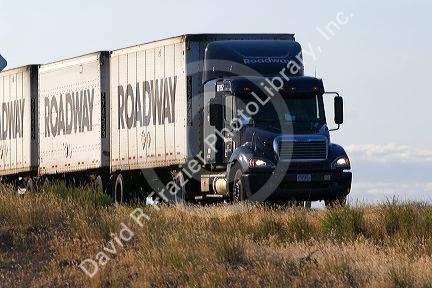 Truck hauling triple freight trailers on Interstate 84 near Boise, Idaho, USA.