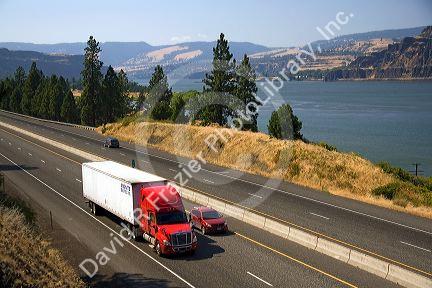 Truck transporting freight through the Columbia River Gorge near Hood River, Oregon, USA.