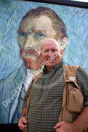 David R. Frazier stands in front of a Van Gogh self portrait outside of the Musee d'Orsay in Paris, France.