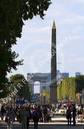 The Obelisk of Luxor located in the Place de la Concorde and the Arch de Triomphe at the west end of the Avenue des Champs-Elysees in Paris, France.