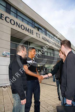 Students socialize in front of the Paul Verlaine University administrative building in Metz, France.