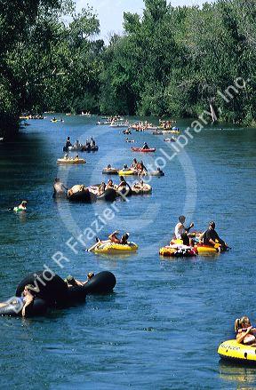 People float down the Boise River on inner tubes and rafts in Boise, Idaho.