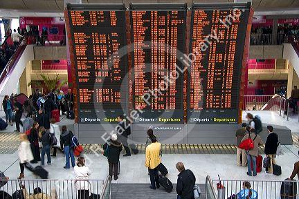 Departure board located in the Paris-Charles de Gaulle Airport, Paris, France.