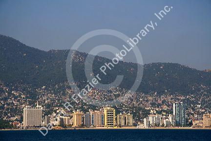 Acapulco Bay lined with hotels in Acapulco, Guerrero, Mexico.