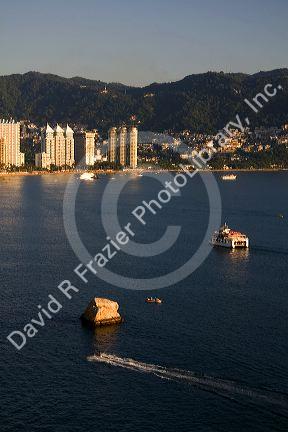 Acapulco Bay lined with hotels in Acapulco, Guerrero, Mexico.