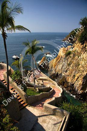 Stairway down the cliff to the bay at Acapulco, Guerrero, Mexico.