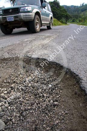 Pothole in the surface of a roadway near the town of Nuevo Arenal, Costa Rica.
