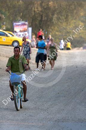 Bicyclist in the town of Tamarindo on the Northern Pacific Coast of Costa Rica.