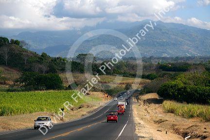 Traffic along the Pan American Highway CR1 just west of San Jose, Costa Rica.