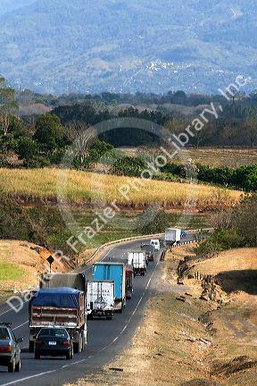 Traffic along the Pan American Highway CR1 just west of San Jose, Costa Rica.
