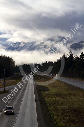 Fog and low clouds over the Cascade Range along Interstate 90 near Ellensburg, Washington, USA.