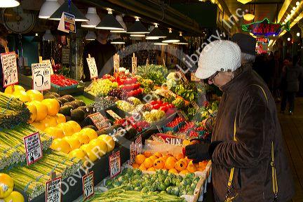 Vendor selling produce at the Pike Place Market in Seattle, Washington, USA.