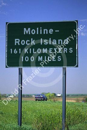 Road sign showing distance in kilometers and miles along Interstate 80 near Moline, Illinois, USA.