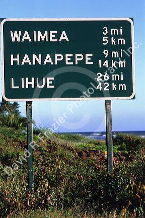 Road sign showing distance in kilometers and miles on the island of Kauai, Hawaii, USA.